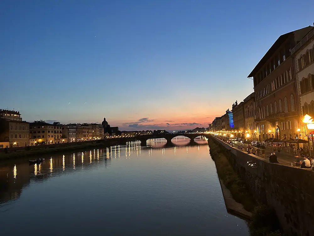 A photo of the Arno River at night