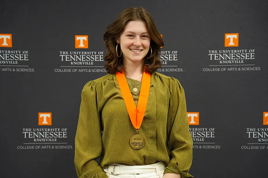 Emma Miller stands against a University of Tennessee backdrop at the ASURes Reception.