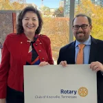 Associate Professor Matt Buehler, at right, with Shannon Holland, president of the Downtown Rotary Club of Knoxville.