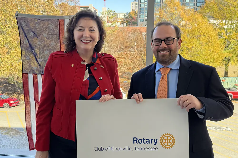 Associate Professor Matt Buehler, at right, with Shannon Holland, president of the Downtown Rotary Club of Knoxville.